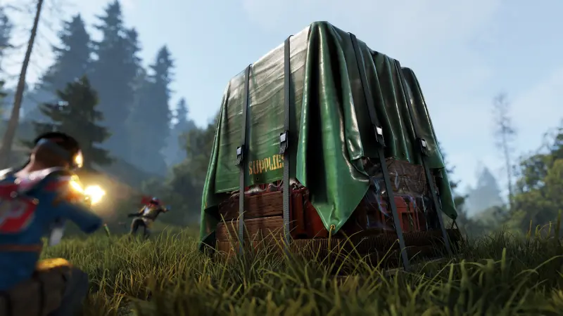 Players fighting around a green tarp supply drop crate in tall grass